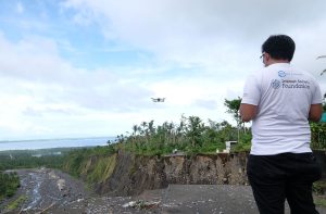 Man operating a drone