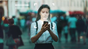 An illustrative photo of a woman with a cellphone to show Identification and privacy in context of modern digital technologies.