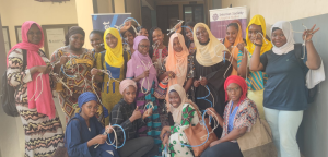 Mali Chapter program participants. You can see a dozen of woman with cables after the IT training.